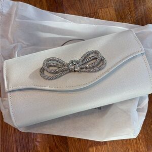 Elegant White Clutch with Rhinestone Bow